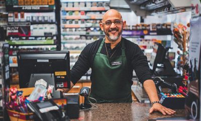 A small business owner at work in his small convenience store.
